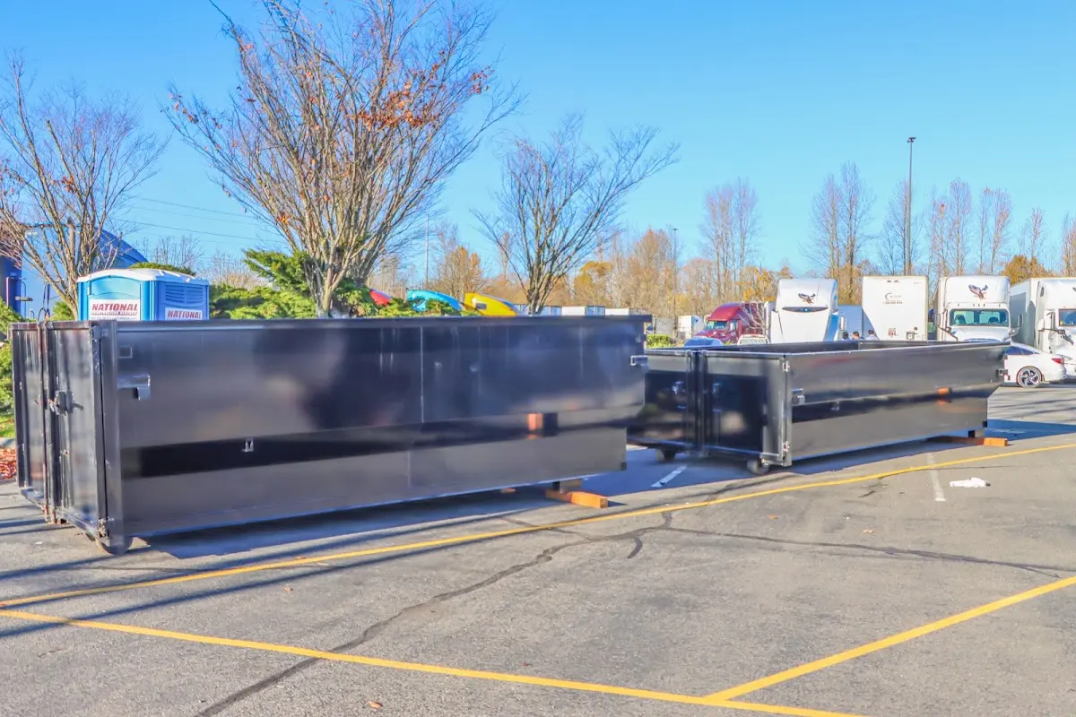 Professional dumpster rental service with roll-off container on residential driveway in Whitemarsh Island